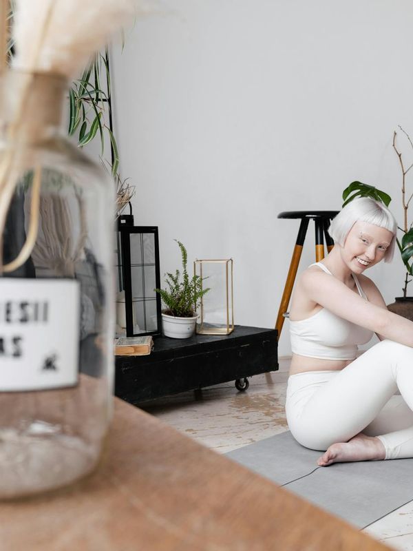 Interior of a calm, minimalist yoga studio with natural light.