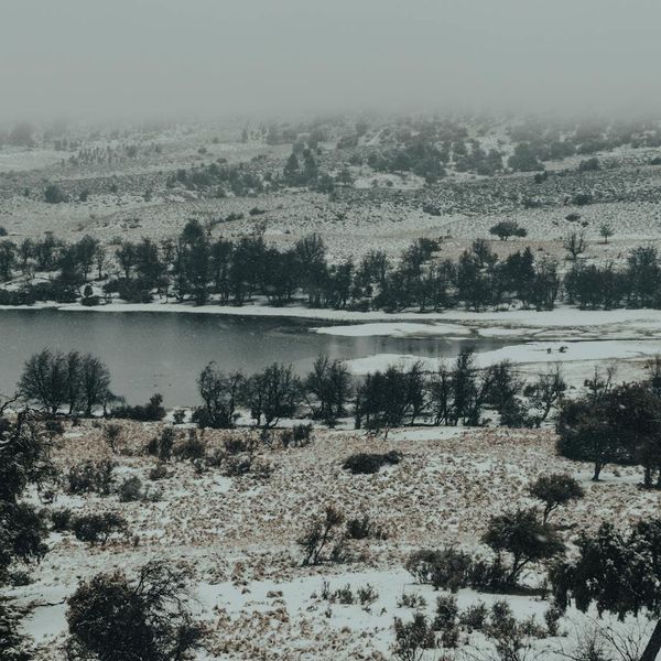 Person meditating peacefully in a calm environment with a soft glow.
